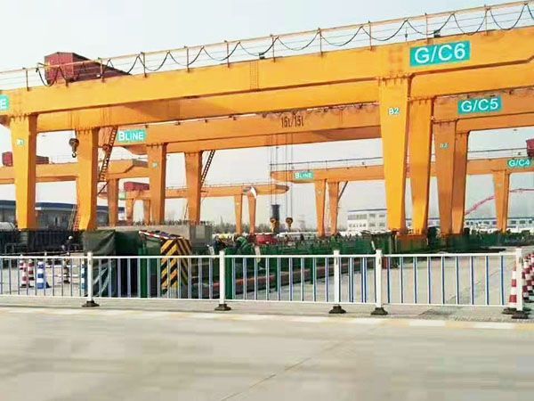What is the difference between a gantry crane and a regular crane